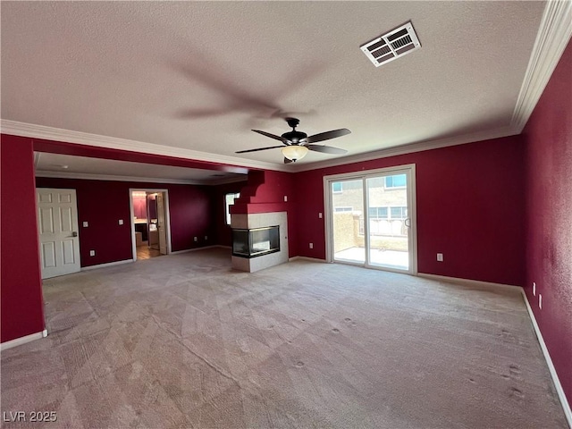 2112 Merganser Ct, North Las Vegas, NV 89084 - unfurnished living room with a multi sided fireplace, ornamental molding, ceiling fan, a textured ceiling, and carpet flooring