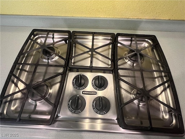 2112 Merganser Ct, North Las Vegas, NV 89084 - kitchen view of stainless steel gas stovetop and a textured wall