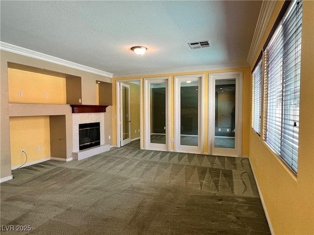 2112 Merganser Ct, North Las Vegas, NV 89084 - unfurnished living room with ornamental molding, baseboards, carpet flooring, a tiled fireplace, and a textured ceiling