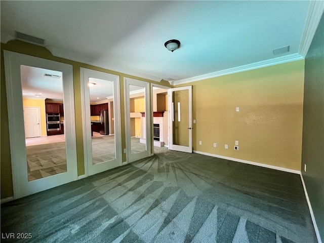 2112 Merganser Ct, North Las Vegas, NV 89084 - unfurnished room featuring crown molding, carpet flooring, and baseboards