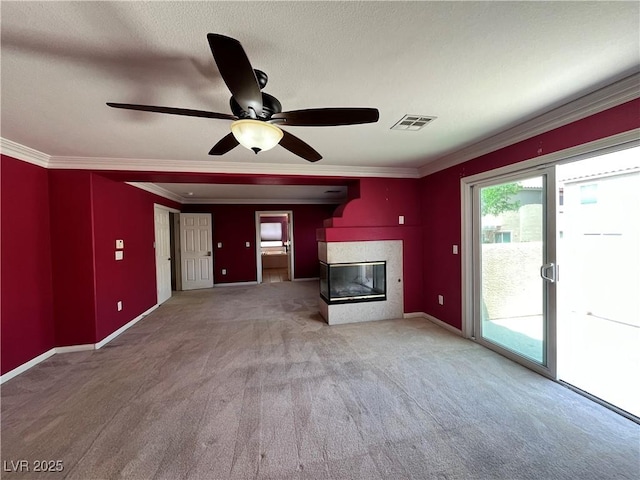 2112 Merganser Ct, North Las Vegas, NV 89084 - unfurnished living room with carpet flooring, ornamental molding, a fireplace, a ceiling fan, and baseboards