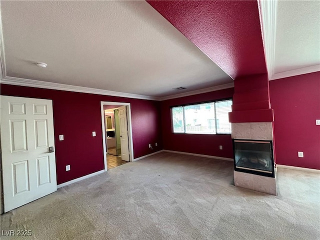 2112 Merganser Ct, North Las Vegas, NV 89084 - unfurnished living room featuring ornamental molding, a textured ceiling, carpet, a tiled fireplace, and baseboards