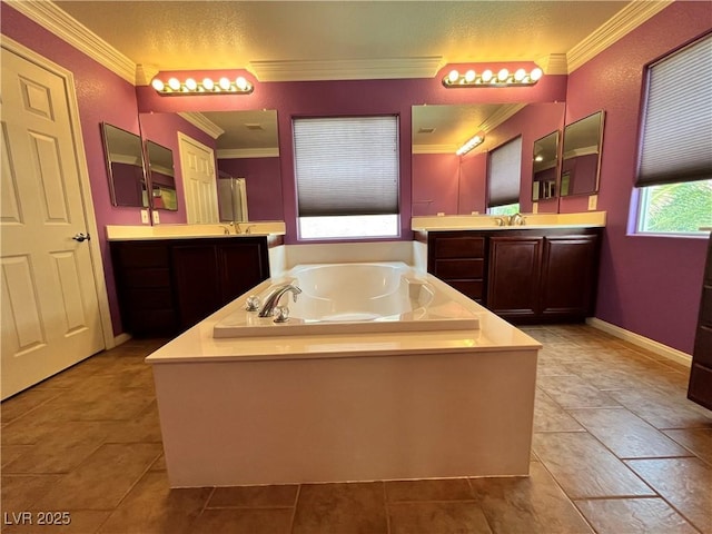 2112 Merganser Ct, North Las Vegas, NV 89084 - full bath with crown molding, a bath, two vanities, tile patterned flooring, and baseboards