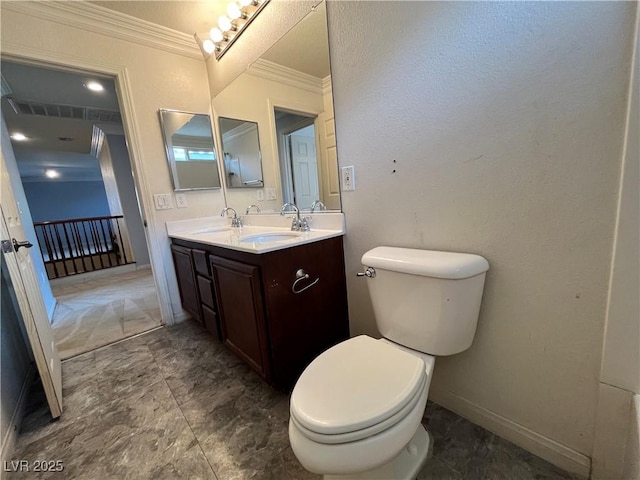 2112 Merganser Ct, North Las Vegas, NV 89084 - bathroom featuring ornamental molding, double vanity, toilet, and baseboards