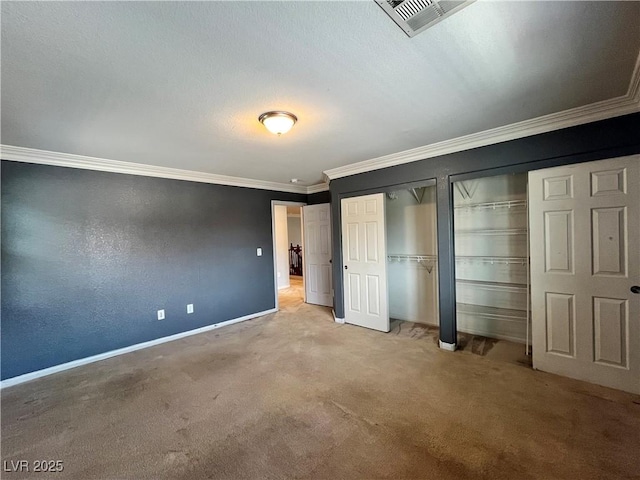 2112 Merganser Ct, North Las Vegas, NV 89084 - unfurnished bedroom with multiple closets, crown molding, carpet, and baseboards