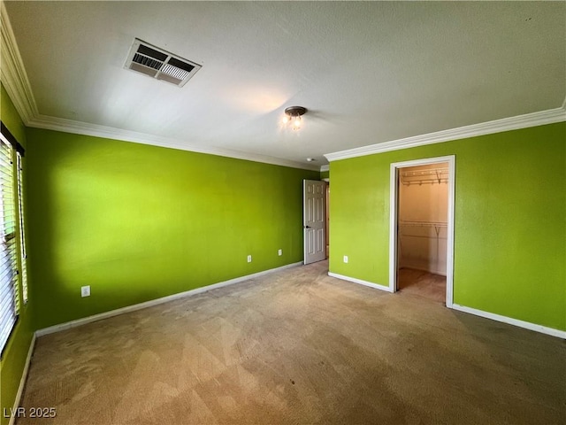 2112 Merganser Ct, North Las Vegas, NV 89084 - unfurnished bedroom with crown molding, carpet flooring, baseboards, a walk in closet, and a closet