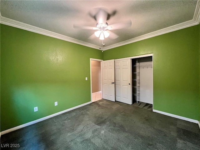 2112 Merganser Ct, North Las Vegas, NV 89084 - unfurnished bedroom with ornamental molding, baseboards, dark carpet, a closet, and a ceiling fan