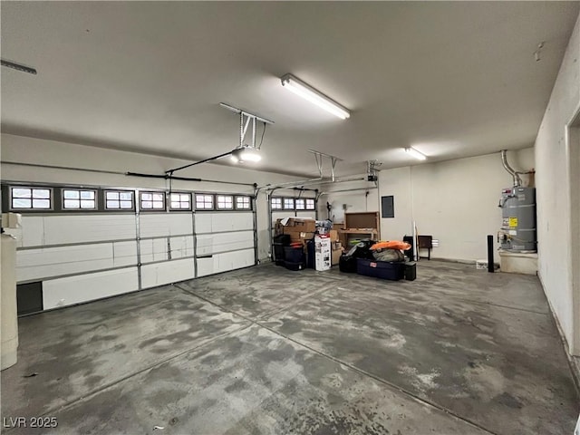 2112 Merganser Ct, North Las Vegas, NV 89084 - garage with secured water heater and a garage door opener