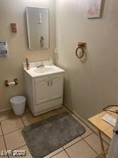 bathroom with tile patterned floors, vanity, and toilet