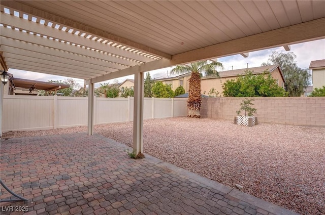 view of patio featuring a fenced backyard and a pergola