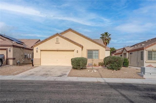 ranch-style house with concrete driveway, stucco siding, a garage, and a tiled roof