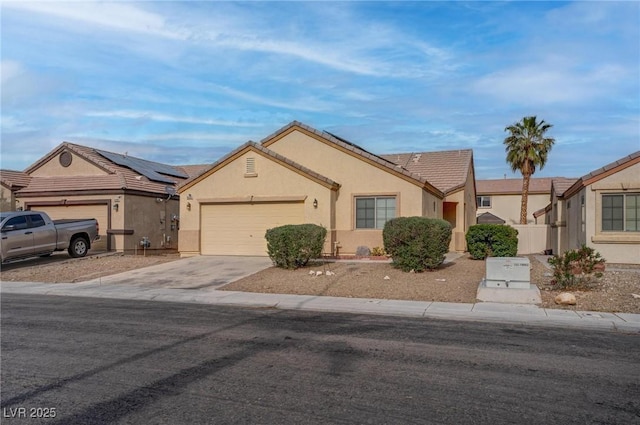 single story home featuring concrete driveway, a garage, stucco siding, a tile roof, and fence