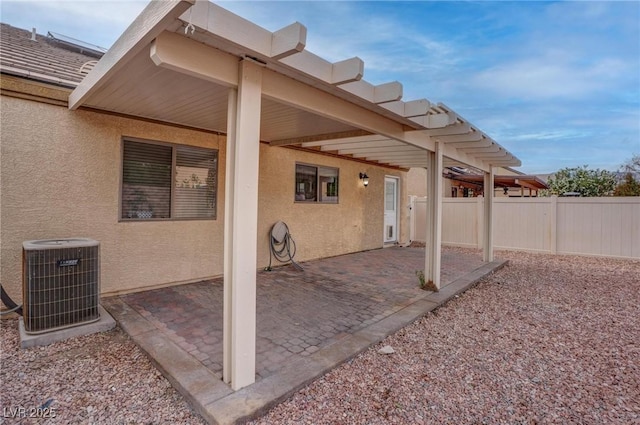view of patio / terrace with central AC and fence