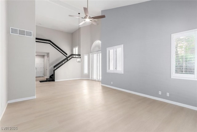 3246 Brookfield Dr, Las Vegas, NV 89120 - unfurnished living room featuring high vaulted ceiling, light wood finished floors, a ceiling fan, and baseboards