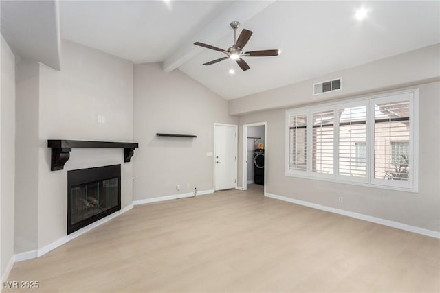3246 Brookfield Dr, Las Vegas, NV 89120 - unfurnished living room with light wood-style floors, washer / dryer, ceiling fan, a glass covered fireplace, and baseboards