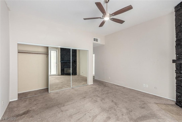 3246 Brookfield Dr, Las Vegas, NV 89120 - unfurnished bedroom with a fireplace, carpet flooring, a closet, and baseboards
