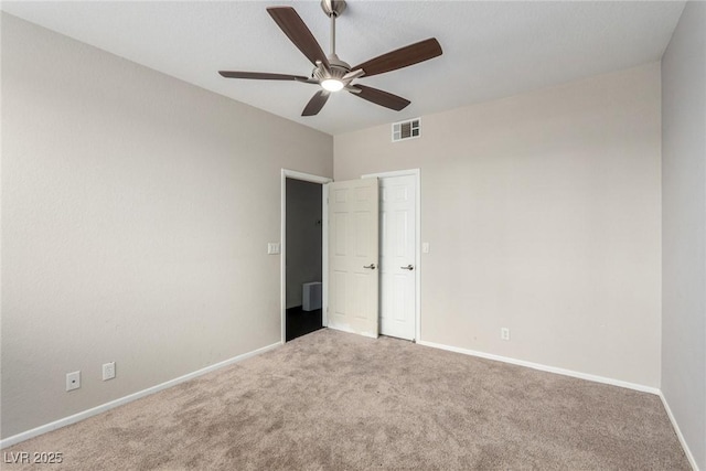 3246 Brookfield Dr, Las Vegas, NV 89120 - unfurnished bedroom with carpet, baseboards, and a ceiling fan