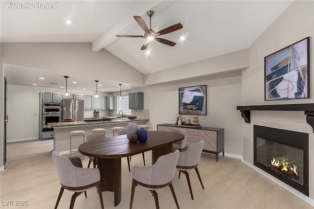 3246 Brookfield Dr, Las Vegas, NV 89120 - dining room with light wood-type flooring, ceiling fan, a glass covered fireplace, and recessed lighting