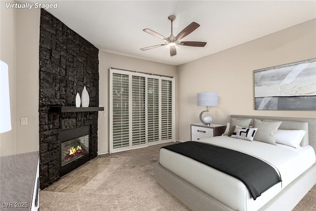 3246 Brookfield Dr, Las Vegas, NV 89120 - carpeted bedroom with a fireplace and a ceiling fan