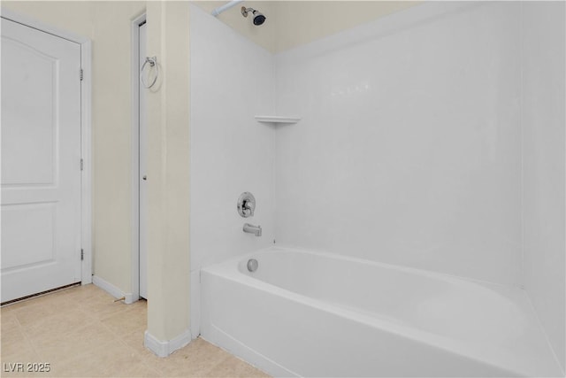 full bathroom with tub / shower combination, tile patterned floors, and baseboards