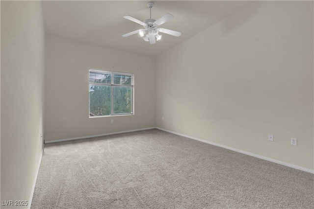 empty room featuring carpet floors, ceiling fan, and baseboards