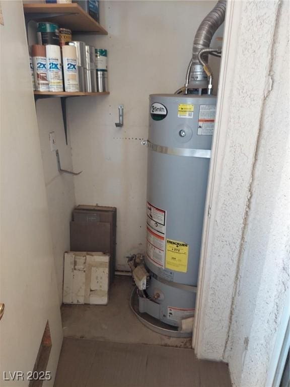 utility room featuring secured water heater