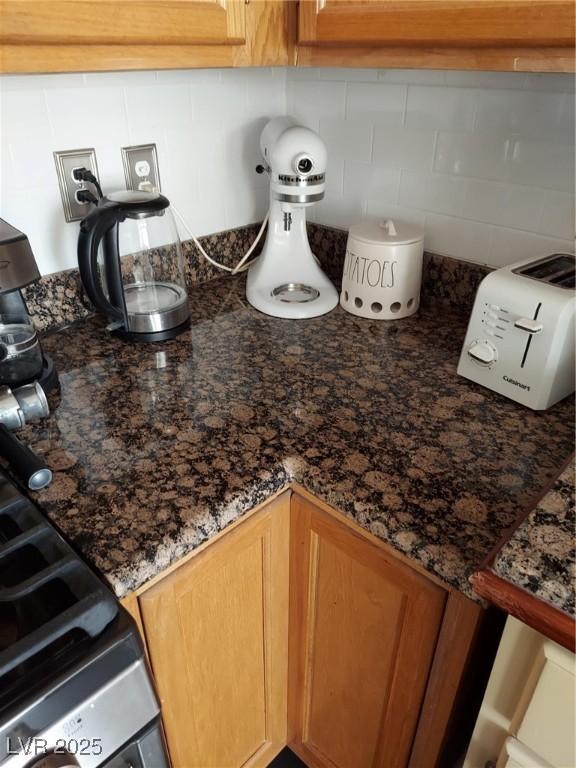 kitchen view of backsplash and brown cabinetry