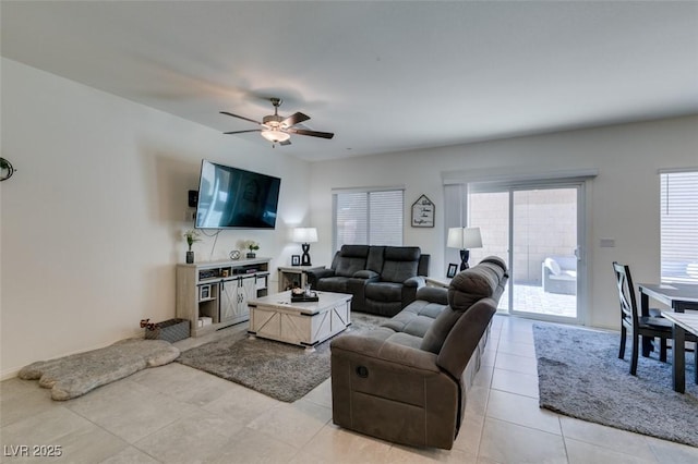 living area featuring ceiling fan and light tile patterned floors
