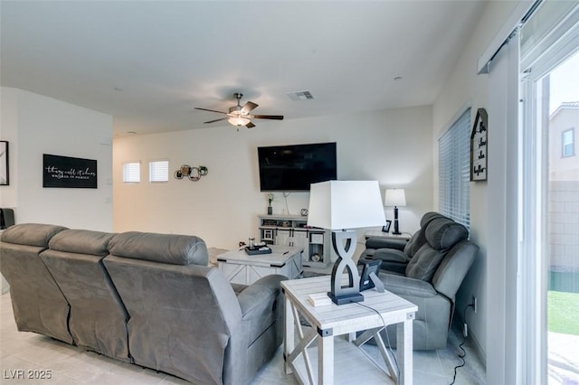 living area featuring a ceiling fan