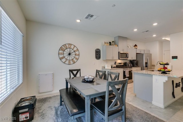 dining space with recessed lighting