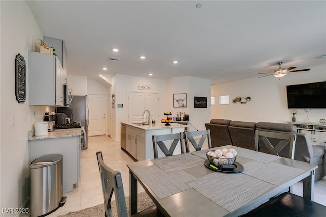 dining space featuring ceiling fan, recessed lighting, and light tile patterned floors