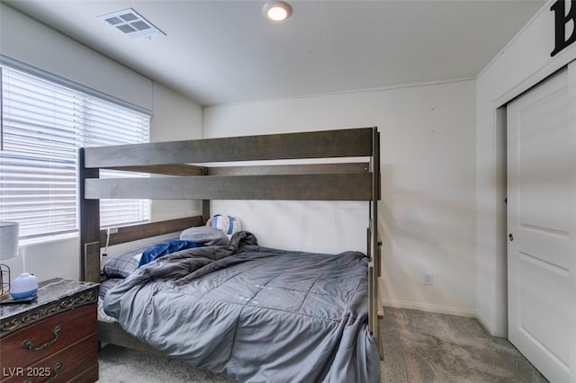 carpeted bedroom with baseboards