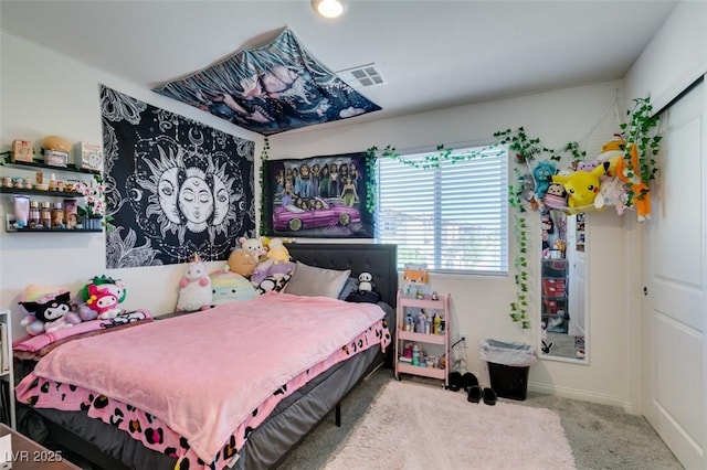 carpeted bedroom with baseboards