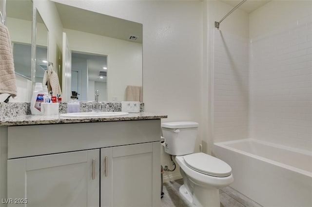 full bathroom featuring toilet, shower / bathtub combination, and vanity
