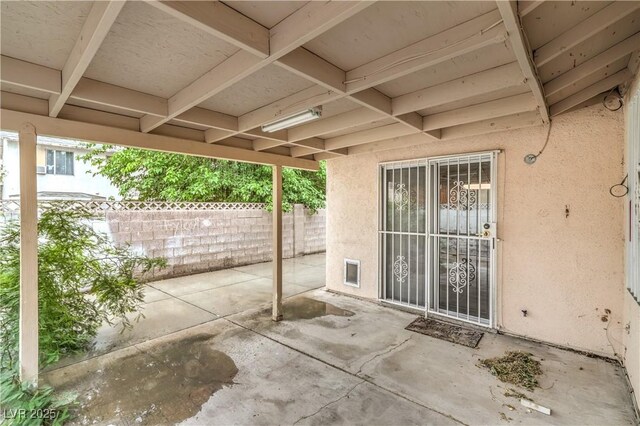 view of patio / terrace featuring fence