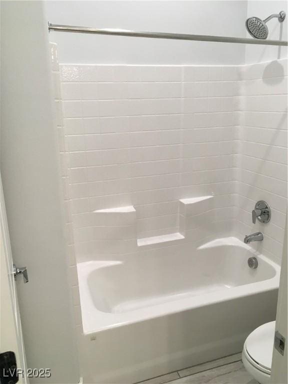 bathroom with toilet and shower / bathtub combination