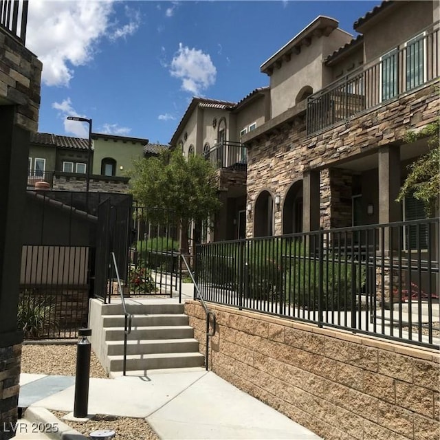 view of gate with fence
