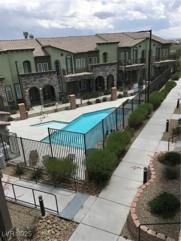community pool featuring fence