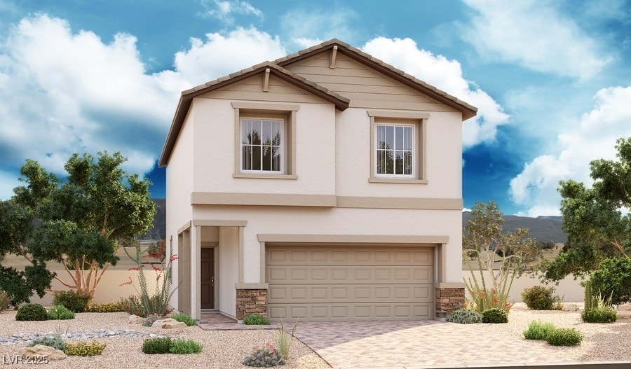 1006 Smiths Island Ave, North Las Vegas, NV 89084 - view of front of house featuring decorative driveway, stone siding, stucco siding, and an attached garage