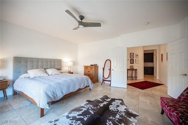 bedroom with ceiling fan and light tile patterned floors