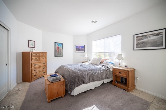 bedroom featuring baseboards