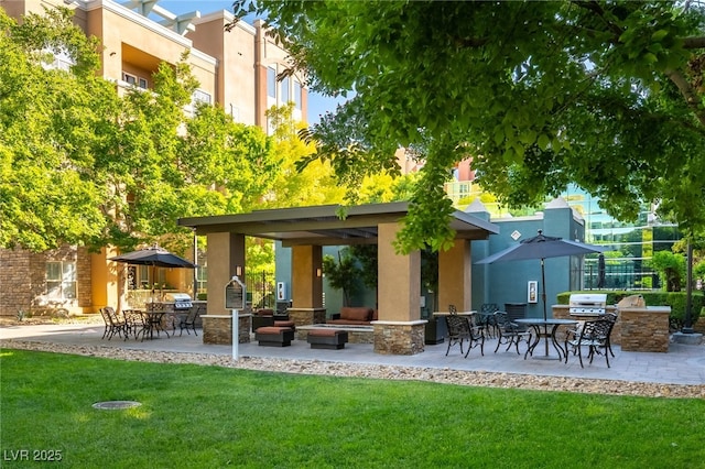 20 E Serene Ave Unit 111, Las Vegas, NV 89123 - rear view of house featuring area for grilling, a yard, stucco siding, and a patio area