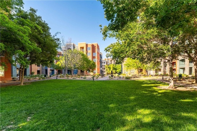 20 E Serene Ave Unit 111, Las Vegas, NV 89123 - view of community with a yard