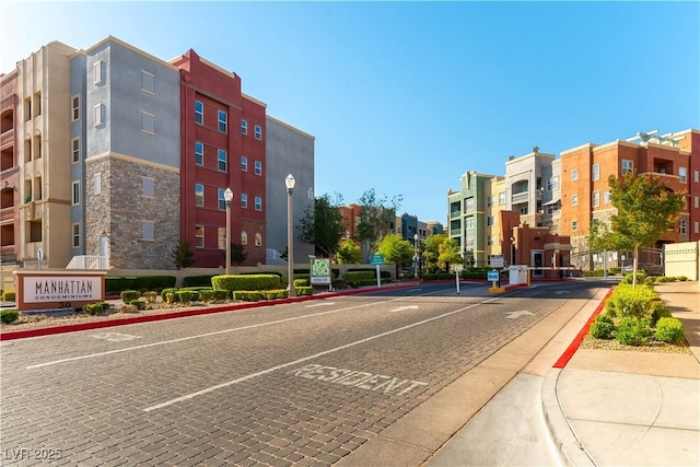 20 E Serene Ave Unit 111, Las Vegas, NV 89123 - view of road featuring curbs, street lights, and sidewalks