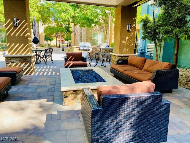20 E Serene Ave Unit 111, Las Vegas, NV 89123 - view of patio / terrace featuring an outdoor living space with a fire pit, area for grilling, and outdoor dining area