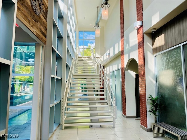 20 E Serene Ave Unit 111, Las Vegas, NV 89123 - lobby with a high ceiling, stairs, and a security system