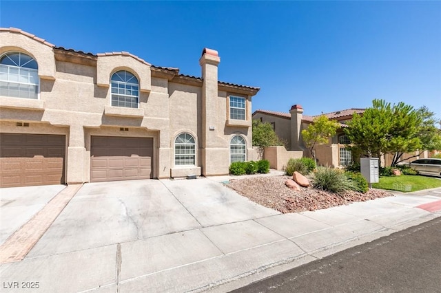 7732 Almeria Ave, Las Vegas, NV 89128 - mediterranean / spanish-style house with a chimney, driveway, stucco siding, a tiled roof, and a garage