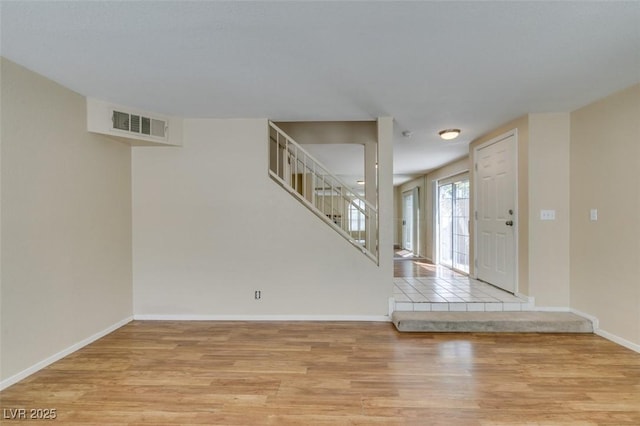 7732 Almeria Ave, Las Vegas, NV 89128 - entrance foyer featuring wood finished floors, stairs, and baseboards