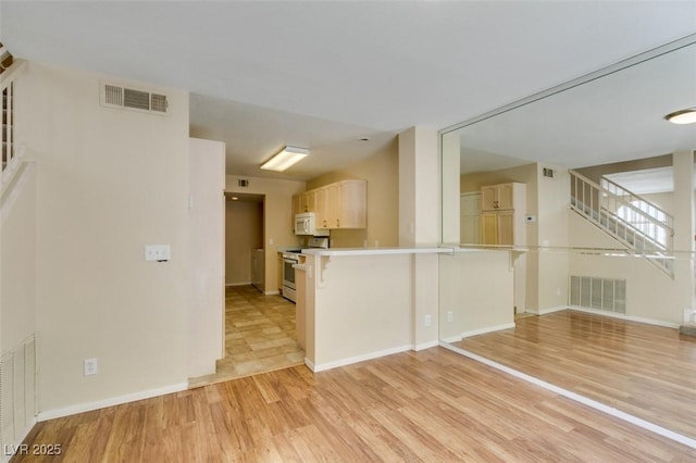 7732 Almeria Ave, Las Vegas, NV 89128 - unfurnished living room with stairs, light wood finished floors, and baseboards