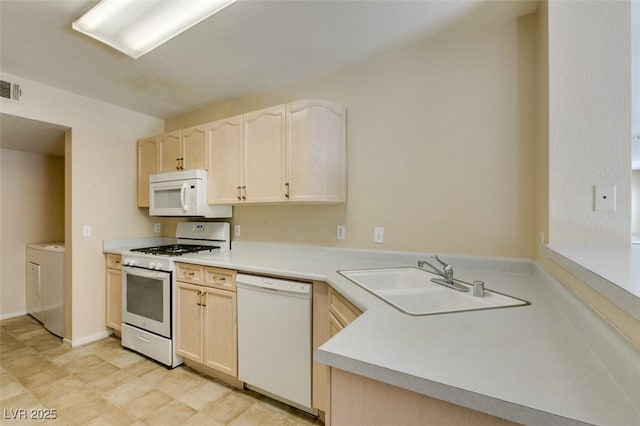 7732 Almeria Ave, Las Vegas, NV 89128 - kitchen with white appliances, a sink, washer / clothes dryer, and light brown cabinets